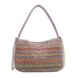 Rainbow straw beach bag with pink butterfly embroidery and purple leather strap
