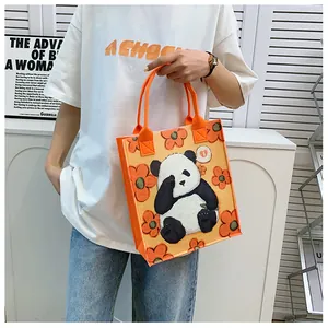 Orange felt panda tote bag featuring cute cartoon patterns for daily casual use