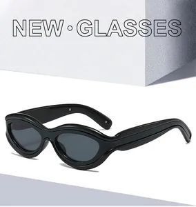 Detail view of thick black oval frames and polished finish of premium sunglasses
