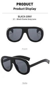 Detail view of oversized black square sunglasses with grey lenses from front and side angles