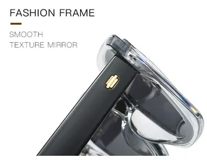Détail de la branche noire avec charnière dorée et monture de lunettes tendance