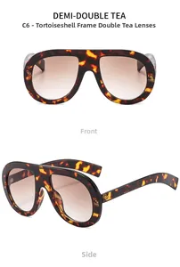 Detail view of tortoiseshell oversized sunglasses with brown gradient lenses and wide temples