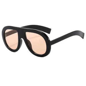 Retro oversized aviator sunglasses with black frames and translucent amber lenses for fashion
