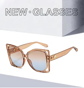 Detail view of stylish square sunglasses with amber frames and gradient blue lenses