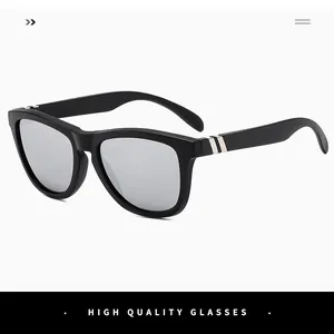 Detail of black sports sunglasses with silver metal accents and reflective gray lenses