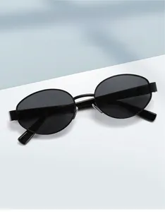 Macro view of vintage black oval sunglasses with UV protection and minimalist frame