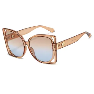 Modern oversized square sunglasses with amber gradient lenses and cutout frame detail