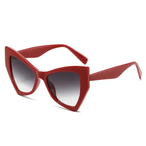 Chic red geometric cat eye sunglasses with dark gradient lenses for high-end fashion