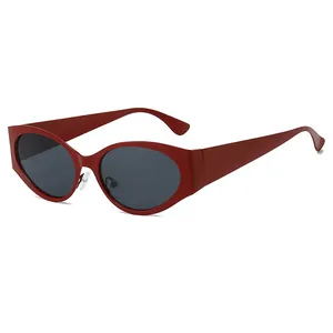 Futuristic Y2K cat-eye sunglasses in dark red finish with dark tinted lenses