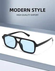 Detail of modern double-bridge sunglasses with black frame and light blue square lenses