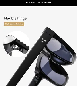 Close-up of flexible hinges and metal rivets on black oversized fashion sunglasses