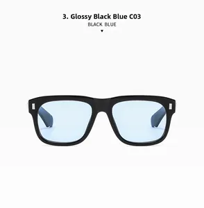 Detail of square black sunglasses frame with blue lenses and silver rivet accents