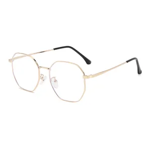 Minimalist gold polygonal metal eyeglass frames with transparent lenses on white background
