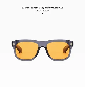 Detailed view of transparent grey square frame sunglasses with yellow lenses and metal studs