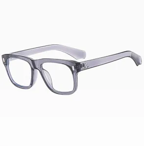 Detail view of transparent grey square frames with metallic rivet hinge and non-slip temples