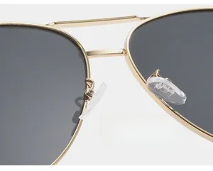 Detail of soft eco-friendly silicone nose pads on gold metal aviator sunglasses