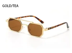 Detail of octagonal gold metal frame sunglasses with tea lenses and tortoise temples