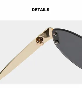 Close-up of sturdy golden metal hinges on rimless sunglasses for durability