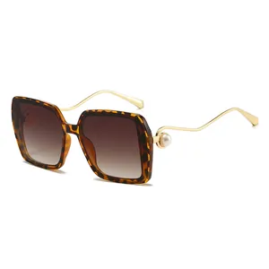 Vintage oversized square sunglasses with tortoiseshell frame and golden wave temples