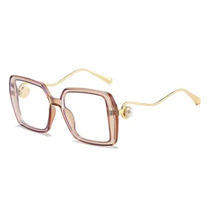 Fashionable oversized square sunglasses with gold wavy metal temples and pearl detail