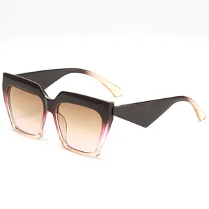 Fashionable oversized gradient cat eye sunglasses with brown to pink lenses for women