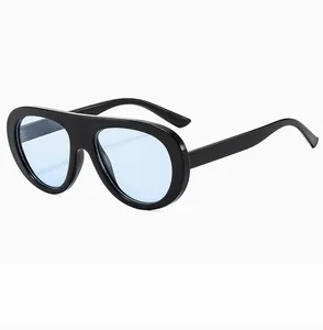 Side view detail of retro sunglasses featuring thick black frames and translucent blue lenses