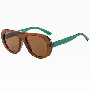 Detail view of vintage aviator sunglasses featuring brown frames and green temples