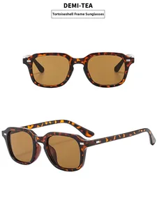 Vertical view of demi-tortoise square sunglasses with tea lenses and silver rivet detail