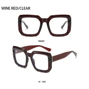 Detail view of wine red square frame sunglasses with textured diamond-cut finish and hinges