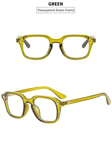 Close-up of retro square green sunglasses with transparent frame and silver rivets