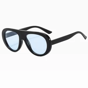 Retro oversized aviator sunglasses with black frame and light blue transparent lenses