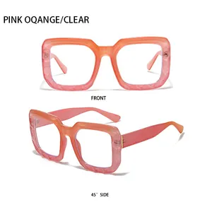 Detail view of square pink orange marble texture eyeglasses frame with clear lenses