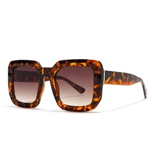 Fashionable oversized square tortoiseshell sunglasses with gradient tea lenses and gold metal trim