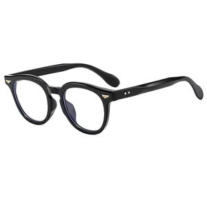 Classic round black frames with golden wing accents and high-gloss finish minimalist style