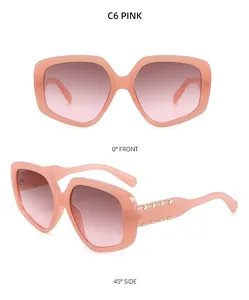 Lunettes de soleil polygonales dégradées roses avec détails métalliques dorés
