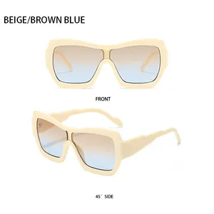 Détails de lunettes de soleil beiges surdimensionnées avec verres dégradés marron-bleu