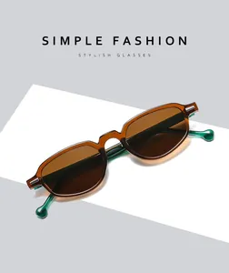 Macro shot of stylish tortoiseshell cat-eye sunglasses with contrasting green temples