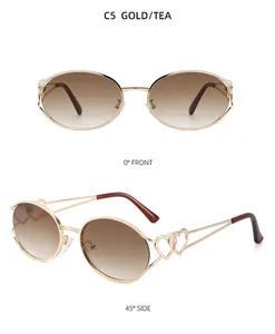 Detail einer ovalen Metall-Sonnenbrille mit Teeverlauf-Gläsern und Herz-Ausschnitt