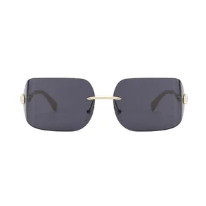 Lunettes de soleil sans monture pour femme avec verres noirs et branches en métal doré