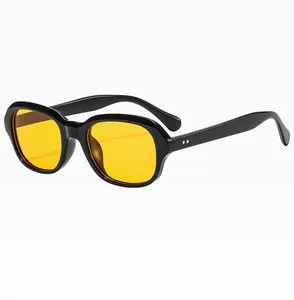 Detailed side view of vintage square frame sunglasses with yellow lenses and black frame