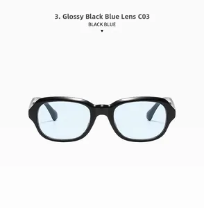 Detail of square black glasses frame with blue transparent lenses and polished finish