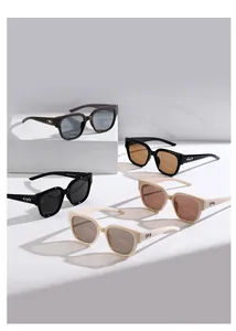 Multiple stylish square sunglasses shown with metallic rivets in various frame colors