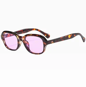 Detail view of tortoiseshell square frame sunglasses with light purple tinted lenses