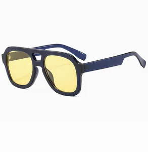 Detailed close-up of retro double-bridge aviator frames with yellow lenses and blue frames