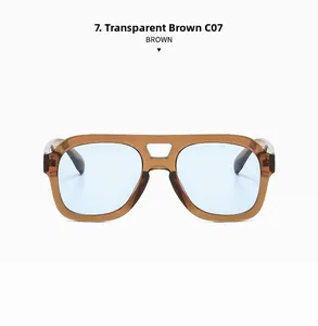 Detail view of retro double-bridge sunglasses with transparent tea brown frames and blue lenses