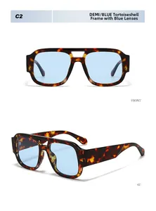 Detail view of vintage tortoise sunglasses with light blue lenses and chunky frame