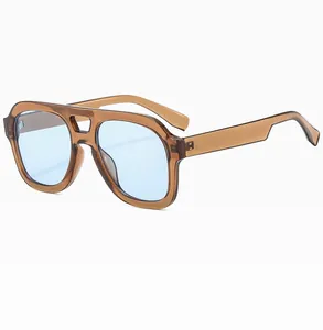 Detail of amber translucent frames with blue lenses and reinforced double bridge design
