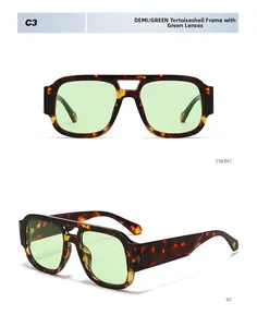 Close-up of tortoise shell aviator sunglasses with dual-bridge and green lenses