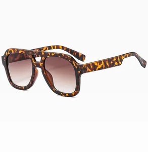 Close-up of tortoise shell frame sunglasses with dual bridge and CE certification marks