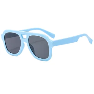 Fashionable double-bridge aviator sunglasses with light blue frames and gray lenses